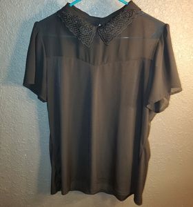 Black short sleeved knit top